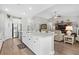 Island kitchen with white cabinets, stainless steel appliances and views into the living room at 7090 Swansong Circle, Myrtle Beach, SC 29579