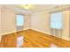 Spacious bedroom with hardwood floors and window coverings at 703 62Nd Ave. N, Myrtle Beach, SC 29572