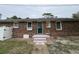 Brick home with green door and small steps at 703 62Nd Ave. N, Myrtle Beach, SC 29572