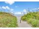 Beach access path through lush vegetation to sandy shore at 915 Cedarwood Circle, Myrtle Beach, SC 29572