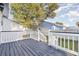 Gray deck with white railings and stairs leading to backyard at 838 Marlin Ct., Murrells Inlet, SC 29576