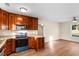 Open concept kitchen and dining area with wood flooring at 3449 Church St., Loris, SC 29569