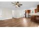 Living room with ceiling fan and wood flooring at 3449 Church St., Loris, SC 29569