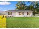 Single story house with gray siding and a front yard at 3449 Church St., Loris, SC 29569