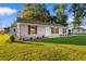 Single story house with gray siding and a front yard at 3449 Church St., Loris, SC 29569