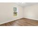Spacious bedroom with a large window and hardwood floors at 3449 Church St., Loris, SC 29569