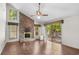 Bright living room with brick fireplace and view of backyard at 19 South Gate Rd., Myrtle Beach, SC 29572