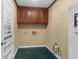 Laundry room with washer/dryer hookups and ample cabinetry at 19 South Gate Rd., Myrtle Beach, SC 29572