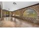 Sunroom with brick walls, arched windows, and tile floor at 19 South Gate Rd., Myrtle Beach, SC 29572