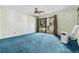 Bedroom with blue carpet, sliding glass doors, and window coverings at 19 South Gate Rd., Myrtle Beach, SC 29572