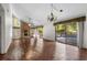Spacious living room featuring a brick fireplace and sliding glass doors at 19 South Gate Rd., Myrtle Beach, SC 29572