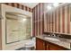 Bathroom with granite countertop, wood cabinets, and tub shower combo at 19 South Gate Rd., Myrtle Beach, SC 29572