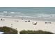 Beachfront property with ocean view and people enjoying the sand at 5714 Springs Ave., Myrtle Beach, SC 29577