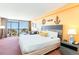 King-size bed, couch, and ocean view from the window at 1501 S Ocean Blvd. # 330, Myrtle Beach, SC 29577