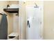 Small closet with shelf, ironing board, and in-room safe at 1501 S Ocean Blvd. # 330, Myrtle Beach, SC 29577