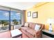 Living room with ocean view and balcony access, featuring comfy couch and coffee table at 1501 S Ocean Blvd. # 330, Myrtle Beach, SC 29577