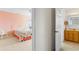 Bedroom with an ensuite bathroom and floral bedding at 108 Burlington St. W, Holden Beach, NC 28462