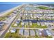 Aerial view of waterfront property with ocean access, showcasing the community and home's location at 108 Burlington St. W, Holden Beach, NC 28462