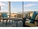 Relaxing screened porch with wicker furniture and a view of the backyard at 1889 Brook Park Pl., Conway, SC 29526