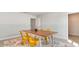 Charming ' room with a wooden table and bright yellow chairs at 1889 Brook Park Pl., Conway, SC 29526