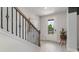 Bright entryway with a staircase featuring an iron railing and hardwood floors at 1889 Brook Park Pl., Conway, SC 29526