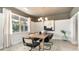 Dining room with a rustic wooden table, chandelier, and decorative artwork at 1889 Brook Park Pl., Conway, SC 29526