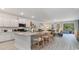 Modern kitchen with white cabinets, granite countertops, and an island with seating at 1889 Brook Park Pl., Conway, SC 29526