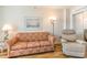 Living room featuring a recliner and patterned sofa at 200 76Th Ave. N # 511, Myrtle Beach, SC 29577