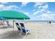 Relaxing beach scene with lounge chairs and umbrellas at 200 76Th Ave. N # 511, Myrtle Beach, SC 29577