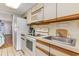 Compact kitchen with microwave and stovetop at 200 76Th Ave. N # 511, Myrtle Beach, SC 29577