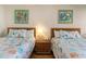 Two twin beds, nightstand, and coastal decor at 200 76Th Ave. N # 511, Myrtle Beach, SC 29577