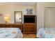 Bedroom with two twin beds and wood dresser at 200 76Th Ave. N # 511, Myrtle Beach, SC 29577