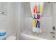 Clean bathroom with shower/tub combo and colorful shower curtain at 200 76Th Ave. N # 511, Myrtle Beach, SC 29577