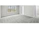Spacious bedroom with gray carpet and access to bathroom at 3539 Rayner Cove Ct., Little River, SC 29566