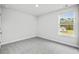 Bright bedroom featuring carpeted floors and a window at 3539 Rayner Cove Ct., Little River, SC 29566