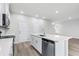 Modern kitchen with white cabinets and a large island at 3539 Rayner Cove Ct., Little River, SC 29566