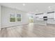Open concept kitchen with white cabinets, island, and stainless steel appliances at 3539 Rayner Cove Ct., Little River, SC 29566