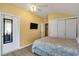 Bedroom with a patterned comforter and a TV at 6001 S Kings Hwy., Myrtle Beach, SC 29575