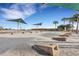 Outdoor cornhole game area with shaded seating at 6001 S Kings Hwy., Myrtle Beach, SC 29575
