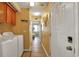 Bright laundry room with washer, dryer, and cabinets at 6001 S Kings Hwy., Myrtle Beach, SC 29575