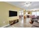 Living room with TV, comfy seating and adjacent dining area at 6001 S Kings Hwy., Myrtle Beach, SC 29575