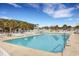 Community pool with plenty of lounge chairs and nearby waterpark at 6001 S Kings Hwy., Myrtle Beach, SC 29575