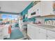 White kitchen with a breakfast bar and ocean view at 6803 N Ocean Blvd. # 230, Myrtle Beach, SC 29572