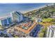 Aerial view showing a complex near the beach with a pool and parking at 6803 N Ocean Blvd. # 230, Myrtle Beach, SC 29572