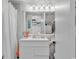Clean bathroom with white vanity, shower, and beach-themed decor at 6803 N Ocean Blvd. # 230, Myrtle Beach, SC 29572