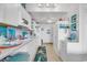 White kitchen with teal accents and starfish rug at 6803 N Ocean Blvd. # 230, Myrtle Beach, SC 29572