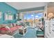 Living room with comfortable seating, ocean view, and teal decor at 6803 N Ocean Blvd. # 230, Myrtle Beach, SC 29572