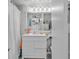 Clean bathroom with white vanity, shower, and beach-themed decor at 6803 N Ocean Blvd. # 230, Myrtle Beach, SC 29572
