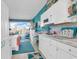 White kitchen with a breakfast bar and ocean view at 6803 N Ocean Blvd. # 230, Myrtle Beach, SC 29572