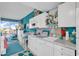 Charming kitchen with white cabinets, teal walls, and starfish decor at 6803 N Ocean Blvd. # 230, Myrtle Beach, SC 29572